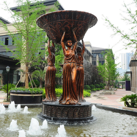 three bronze lady holding pot fountain